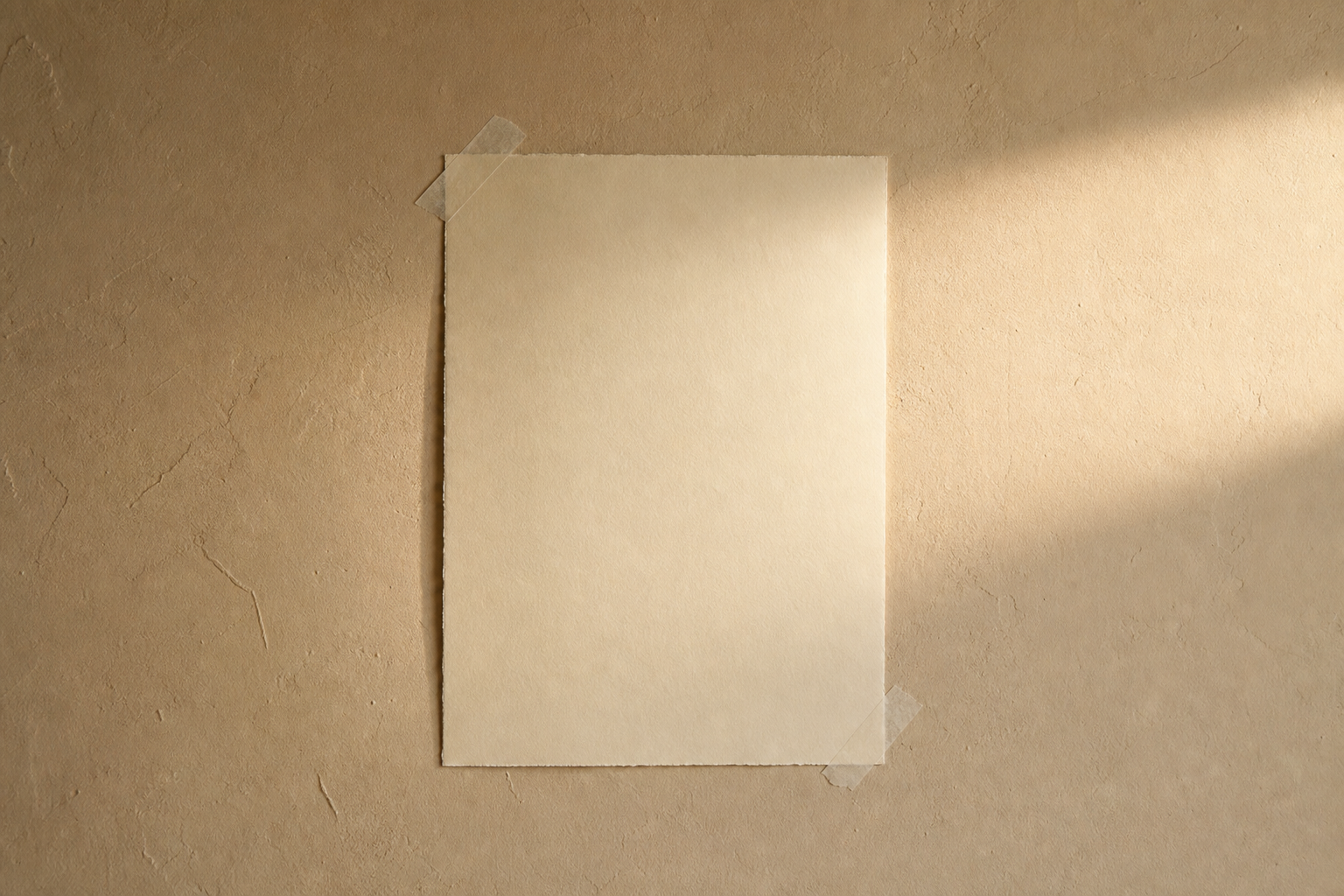 A blank handwritten note on softly taped paper